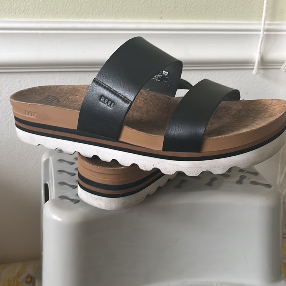 Reef sandals, black leather with cork insole, rubber bottom sole.